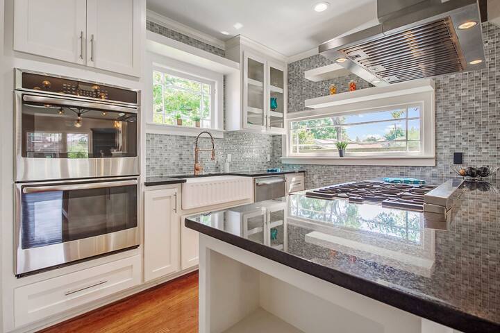 An image of a modern kitchen with sleek appliances, featuring a gas stove, refrigerator, and built-in microwave in Boca Raton
